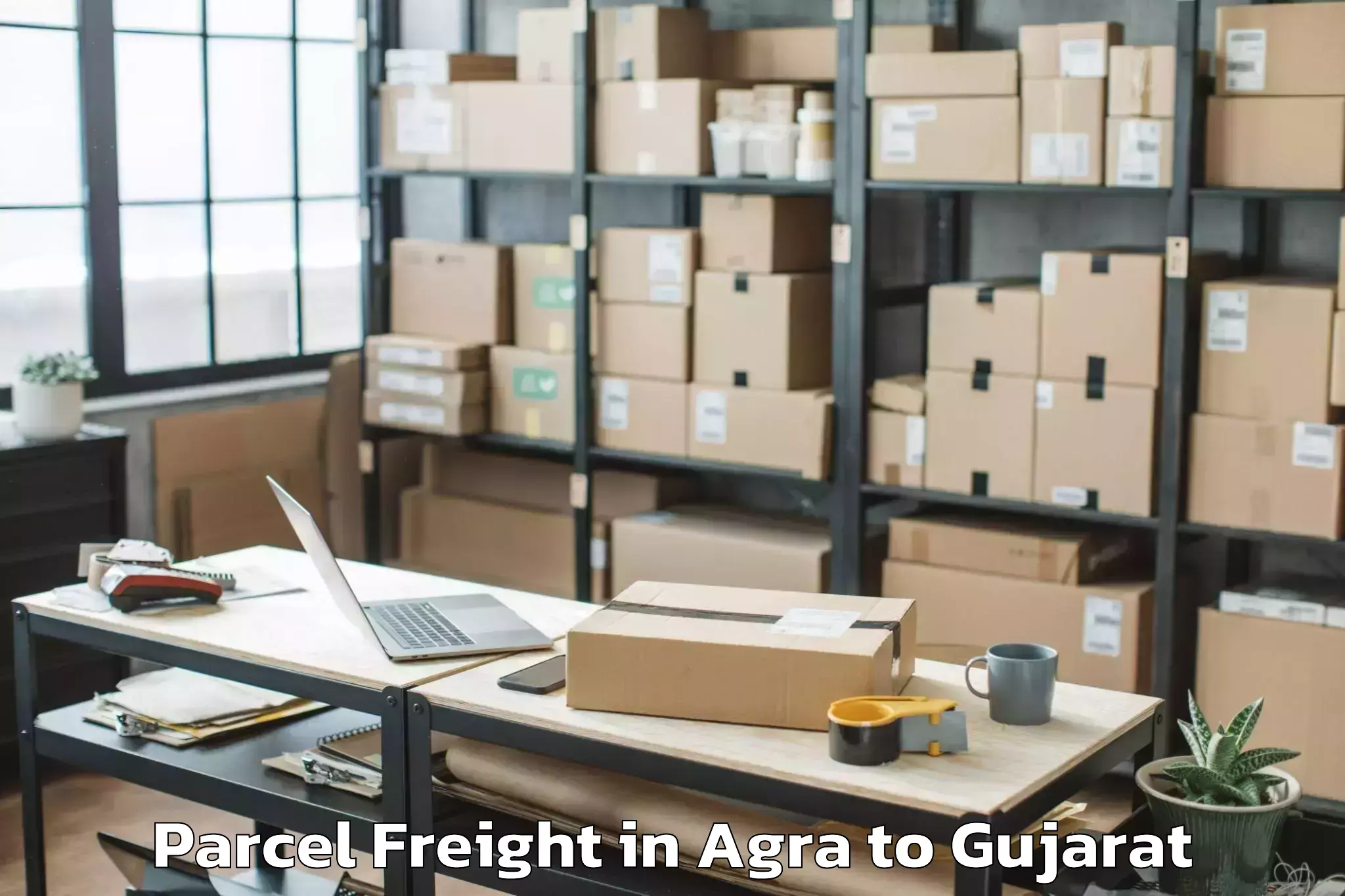 Agra to Kheralu Parcel Freight Booking